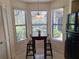 Cozy breakfast nook with views of the lush greenery at 1693 Fry Ct, Dunedin, FL 34698