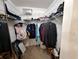 Organized walk-in closet with shelving and hanging space for ample storage solutions at 1693 Fry Ct, Dunedin, FL 34698