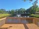 Relaxing deck overlooking the tranquil community pond and fountain at 1693 Fry Ct, Dunedin, FL 34698