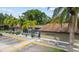 Braemoor Village community building exterior with landscaping at 1693 Fry Ct, Dunedin, FL 34698
