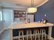 Bright eat-in kitchen features counter seating and ample counter space at 1693 Fry Ct, Dunedin, FL 34698