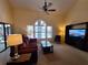 Spacious living room with neutral paint, fan, and large window at 1693 Fry Ct, Dunedin, FL 34698