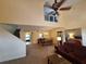 Open-concept living room and dining area showcasing a staircase and open-concept bedroom at 1693 Fry Ct, Dunedin, FL 34698