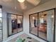 Relaxing patio area with sliding glass doors offering views into adjacent interior rooms at 1693 Fry Ct, Dunedin, FL 34698