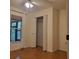 Bright bedroom featuring hardwood floors, closet, and a window with a view at 17631 Grove View Dr, Lutz, FL 33549