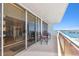 Balcony with outdoor seating, offering serene waterfront views at 17920 Gulf Blvd # 1302, Redington Shores, FL 33708