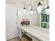 Bathroom vanity features a marble countertop, and decorative pendant lights at 17920 Gulf Blvd # 1302, Redington Shores, FL 33708