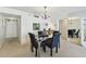 This dining area includes a glass table with seating, complemented by a pass-through to the kitchen at 17920 Gulf Blvd # 1302, Redington Shores, FL 33708