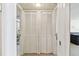 Hallway with linen closet leading to bathroom and living space at 17920 Gulf Blvd # 1302, Redington Shores, FL 33708