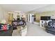 The living area connects to a dining room and offers a mirrored wall that enhances the space at 17920 Gulf Blvd # 1302, Redington Shores, FL 33708