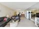 The open floor plan features a spacious living area with comfortable seating and views of the dining area at 17920 Gulf Blvd # 1302, Redington Shores, FL 33708