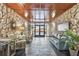 Beautiful lobby with stone walls, tiled floors, a seating area and a view of the beach entrance at 17920 Gulf Blvd # 1302, Redington Shores, FL 33708