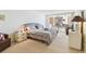 Bright bedroom with neutral carpet, large bed, patio access, and relaxing natural light at 17920 Gulf Blvd # 1302, Redington Shores, FL 33708