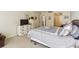 Comfortable bedroom with white dresser, neutral carpet, doorway access, and a queen bed at 17920 Gulf Blvd # 1302, Redington Shores, FL 33708
