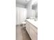 Bathroom featuring a single vanity and framed mirror at 1853 Hovenweep Rd, Wesley Chapel, FL 33543
