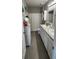 Bathroom includes a double vanity, framed mirrors, a toilet, and a shower with curtain at 1853 Hovenweep Rd, Wesley Chapel, FL 33543