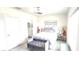Bright bedroom features a comfortable bed, stylish decor, and an adjacent bathroom at 1853 Hovenweep Rd, Wesley Chapel, FL 33543