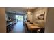 Inviting dining area with wood furniture and decor, connecting seamlessly to the open living space at 1853 Hovenweep Rd, Wesley Chapel, FL 33543