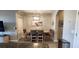 Dining area near a kitchen with stylish furniture and art at 1853 Hovenweep Rd, Wesley Chapel, FL 33543