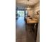 Cozy dining area with a wooden table, stylish chairs, and views of the adjacent living area at 1853 Hovenweep Rd, Wesley Chapel, FL 33543