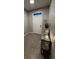 Bright entryway featuring stylish decor, tiled floor, and a charming console table with accent pieces at 1853 Hovenweep Rd, Wesley Chapel, FL 33543