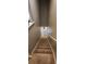Carpeted stairway with painted walls and handrails provides a safe transition between floors at 1853 Hovenweep Rd, Wesley Chapel, FL 33543