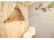 Accessible bathroom with a walk-in tub, shower head, safety bar and blue decorative butterflies at 2101 Sunset Point Rd # 1806, Clearwater, FL 33765