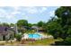 A beautiful community pool surrounded by lush greenery, lounge chairs, and well-maintained landscaping offers relaxation at 2101 Sunset Point Rd # 1806, Clearwater, FL 33765