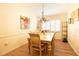 Formal dining room with chandelier and elegant table seating for memorable dining experiences at 2101 Sunset Point Rd # 1806, Clearwater, FL 33765