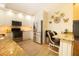 Well-lit kitchen featuring stainless steel appliances, granite countertops, and custom cabinetry, offering modern conveniences at 2101 Sunset Point Rd # 1806, Clearwater, FL 33765