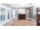Elegant dining area with wood floors, a stylish bar cabinet, and access to the patio at 2188 Kent Ave, Clearwater, FL 33764