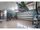 Spacious two-car garage with epoxy flooring, storage shelves, and overhead rack; perfect for storage and organization at 2188 Kent Ave, Clearwater, FL 33764