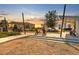 Serene community space with outdoor seating, lush greenery, and charming string lights for relaxing evenings at 2529 Arbor Wind Dr, Lutz, FL 33558