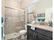 Clean and bright bathroom with glass-enclosed shower and modern vanity at 2608 Calvano Dr, Land O Lakes, FL 34639