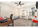 Playful bedroom featuring a vanity, a modern ceiling fan and hardwood floors at 2608 Calvano Dr, Land O Lakes, FL 34639