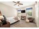 Bedroom with hardwood floors, a ceiling fan, and natural light at 2608 Calvano Dr, Land O Lakes, FL 34639