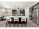 Modern kitchen featuring a large center island with bar seating, stainless steel appliances, and a mosaic backsplash at 2608 Calvano Dr, Land O Lakes, FL 34639