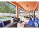 Comfortable seating area and outdoor dining on the screened lanai overlooking the beautiful pool at 2608 Calvano Dr, Land O Lakes, FL 34639