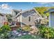 Charming backyard featuring a wooden deck, patio seating, and manicured landscaping at 2628 2Nd N Ave, St Petersburg, FL 33713