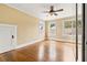 Sunny bedroom with hardwood floors, ceiling fan and natural light from the windows at 2628 2Nd N Ave, St Petersburg, FL 33713
