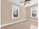 Neutral bedroom featuring natural light from the large windows and ceiling fan at 2628 2Nd N Ave, St Petersburg, FL 33713
