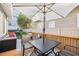 Outdoor deck with table, seating, and umbrella for enjoying the outdoors at 2628 2Nd N Ave, St Petersburg, FL 33713