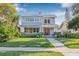 Charming two-story home features a well-manicured lawn and a welcoming front porch at 2628 2Nd N Ave, St Petersburg, FL 33713