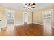 Open living room with hardwood floors, multiple doorways, and neutral paint at 2628 2Nd N Ave, St Petersburg, FL 33713