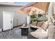 Inviting patio with plush seating, a fire pit, and a shade canopy for relaxing outdoors at 2628 2Nd N Ave, St Petersburg, FL 33713
