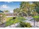 Lush backyard featuring a small shed, manicured lawn, and paver patio with charming outdoor seating at 2710 2Nd N Ave, St Petersburg, FL 33713
