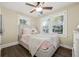 Cozy bedroom showcases natural light with neutral colors providing a serene space for rest and relaxation at 2710 2Nd N Ave, St Petersburg, FL 33713