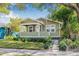 Charming single-story home with green siding, manicured lawn, and a welcoming front porch at 2710 2Nd N Ave, St Petersburg, FL 33713
