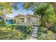 Charming single-story home with green siding, manicured lawn, and a welcoming front porch at 2710 2Nd N Ave, St Petersburg, FL 33713