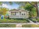 Charming single-story home with green siding, manicured lawn, and a welcoming front porch at 2710 2Nd N Ave, St Petersburg, FL 33713